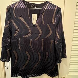 Beautiful women’s Lafayette navy with gold blouse
New with tags
Size large